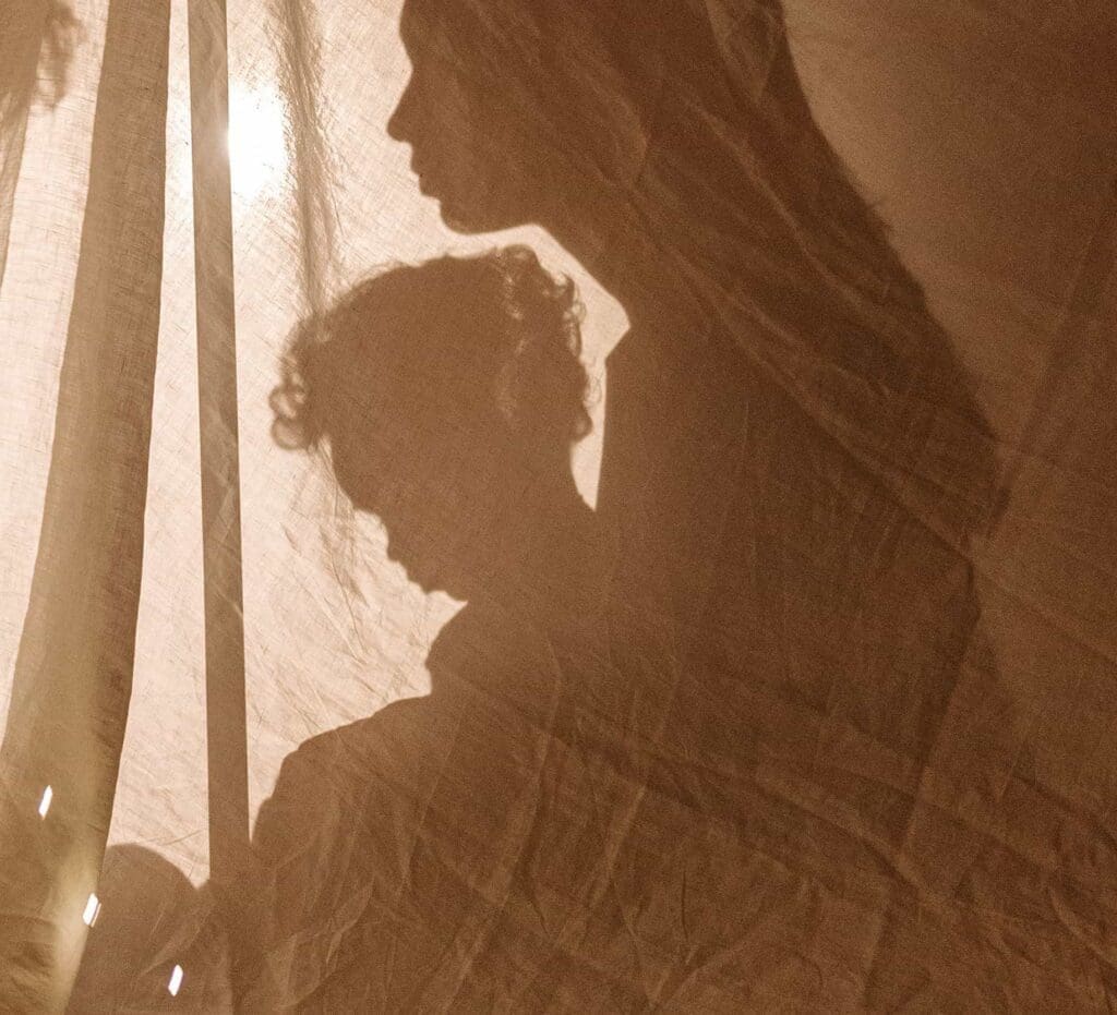 Shadow of a mother holding child